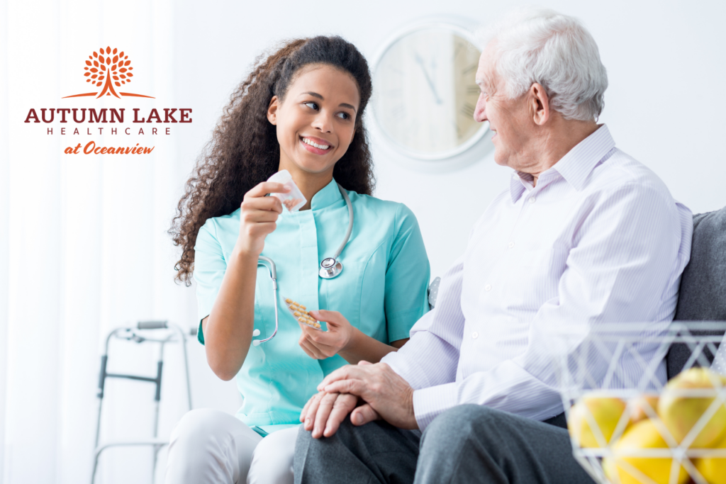 A nurse at a rehabilitation center provides medication and support to a senior man.